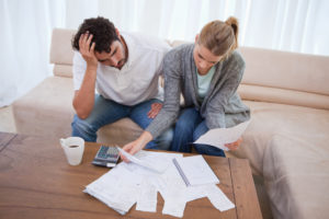 couple looking at bills to file for bankruptcy