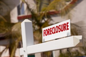 Ponca City Foreclosure Lawyer with foreclosure sign